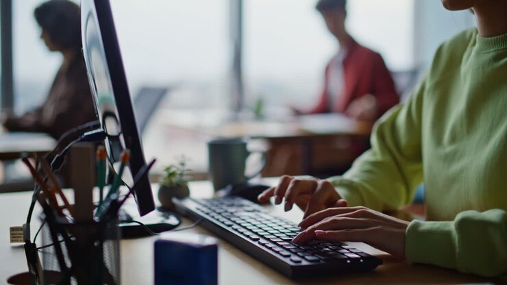 Online manager hands typing keyboard making report corporate office closeup