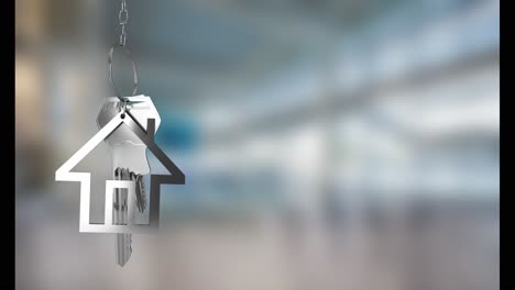 animation of silver house keys hanging against blurred background with copy space