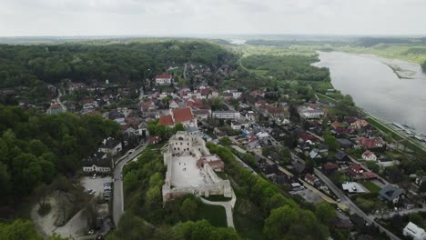 aerial dolley view of the city kazimierz with the dolny castle on the mountain top