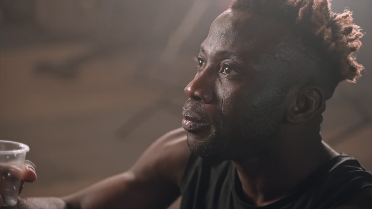 Man Drinking Water After Workout