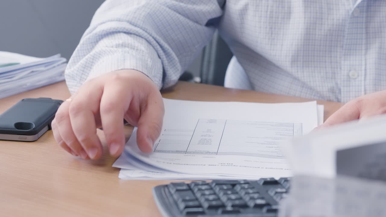 Businessman reviewing documents at his desk