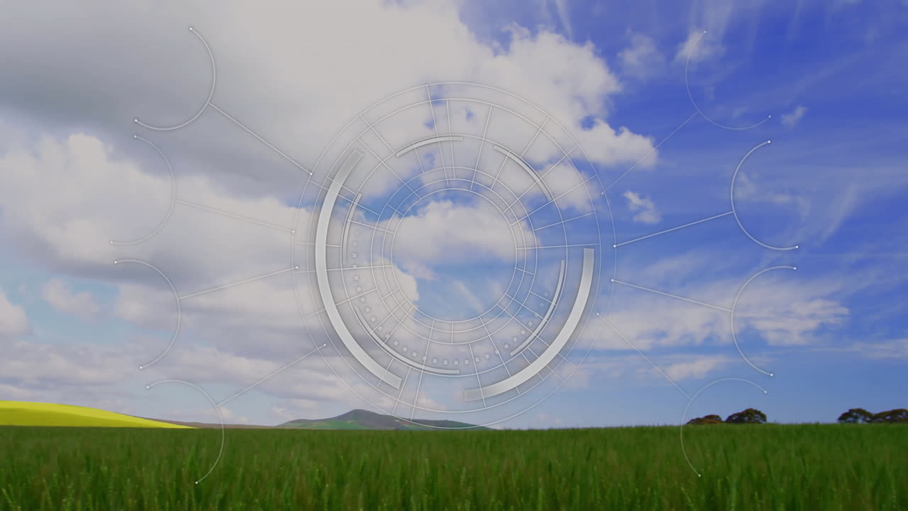 Circular digital interface animation over green field and blue sky with clouds