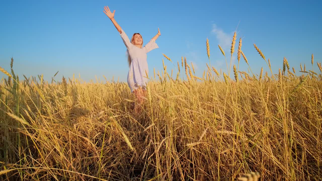 Woman enjoying a wheat field