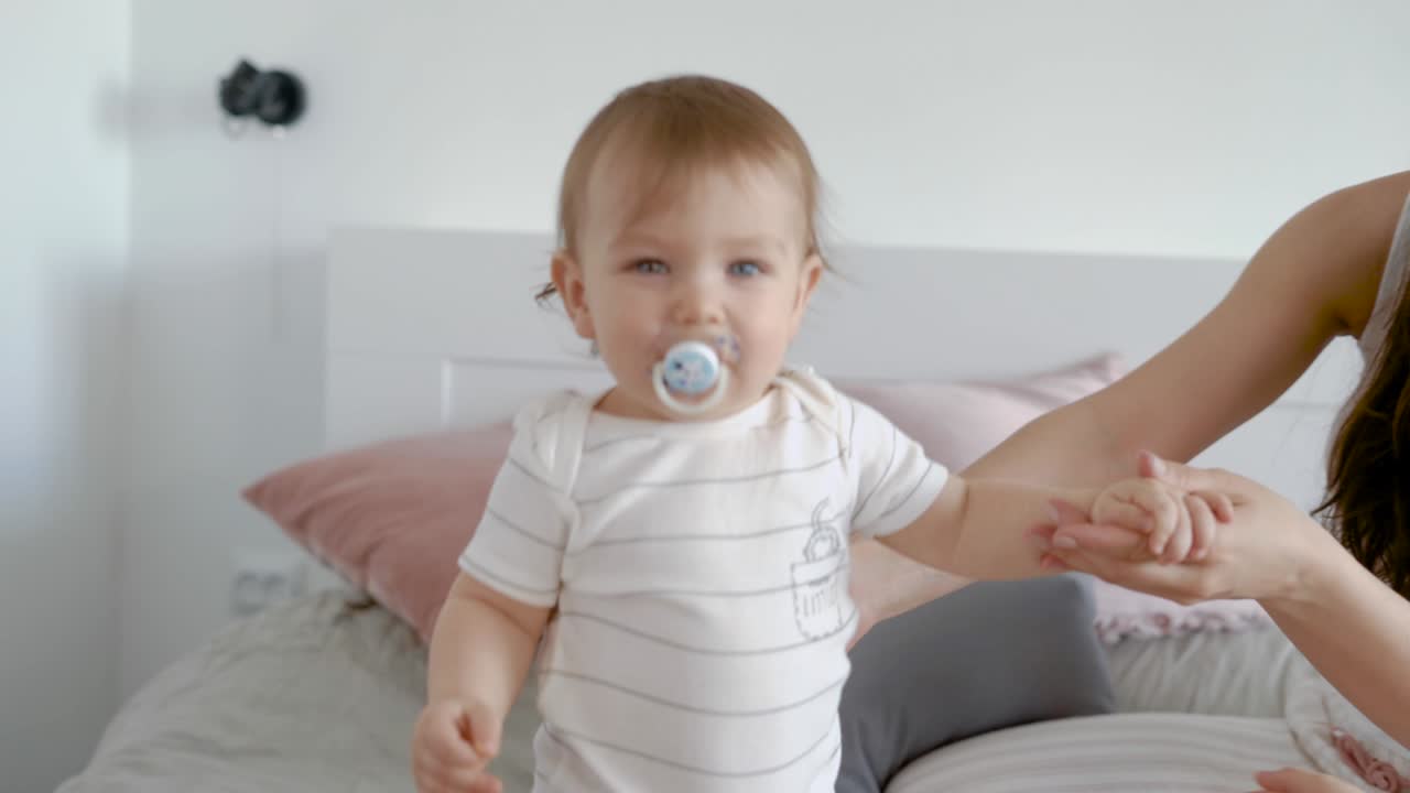 Female parent laughing with kids in room