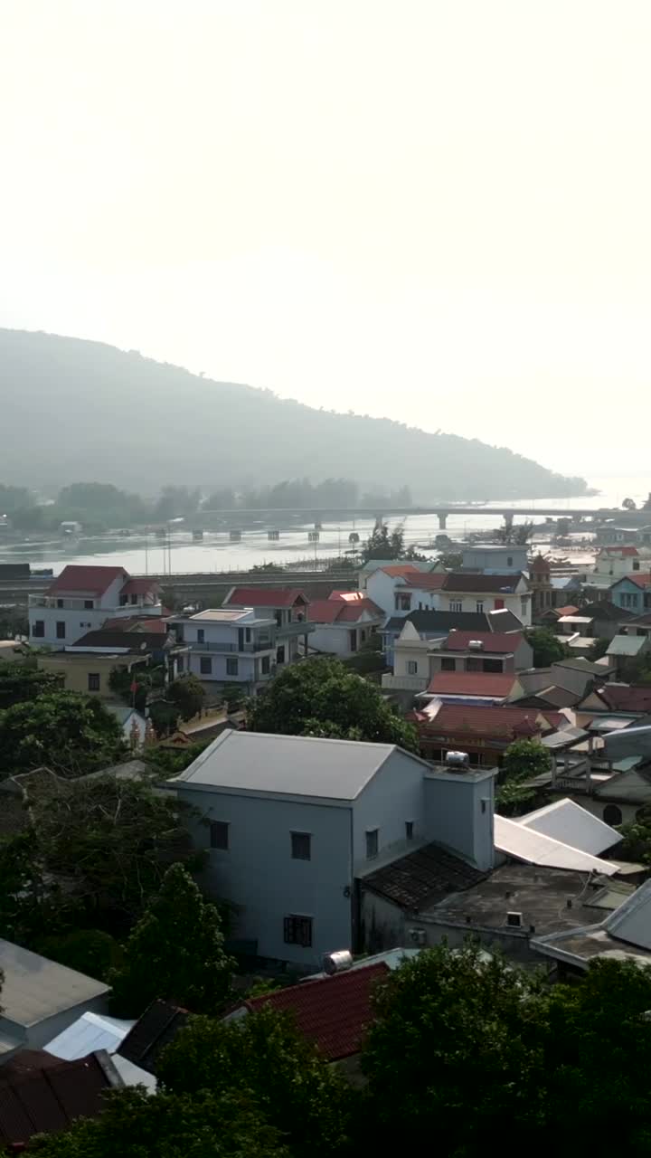 Cityscape with Mountains and Bridge