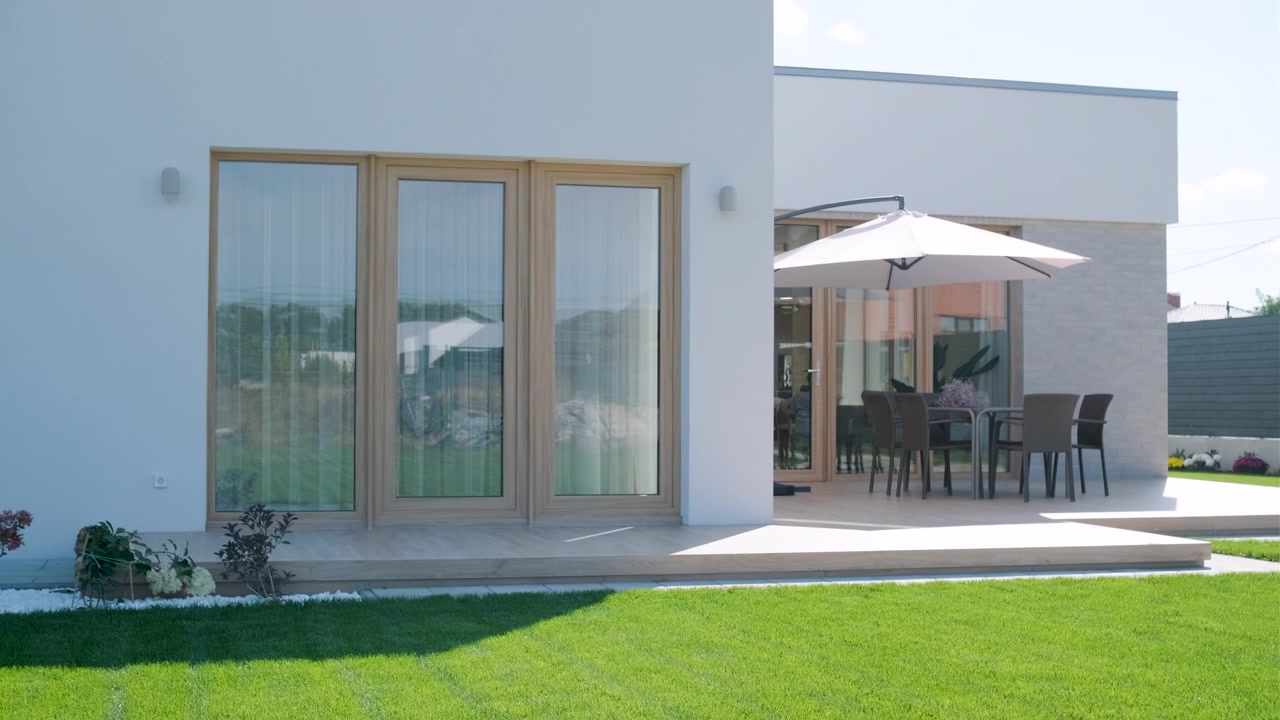 Modern House Exterior with Wooden Deck and Garden