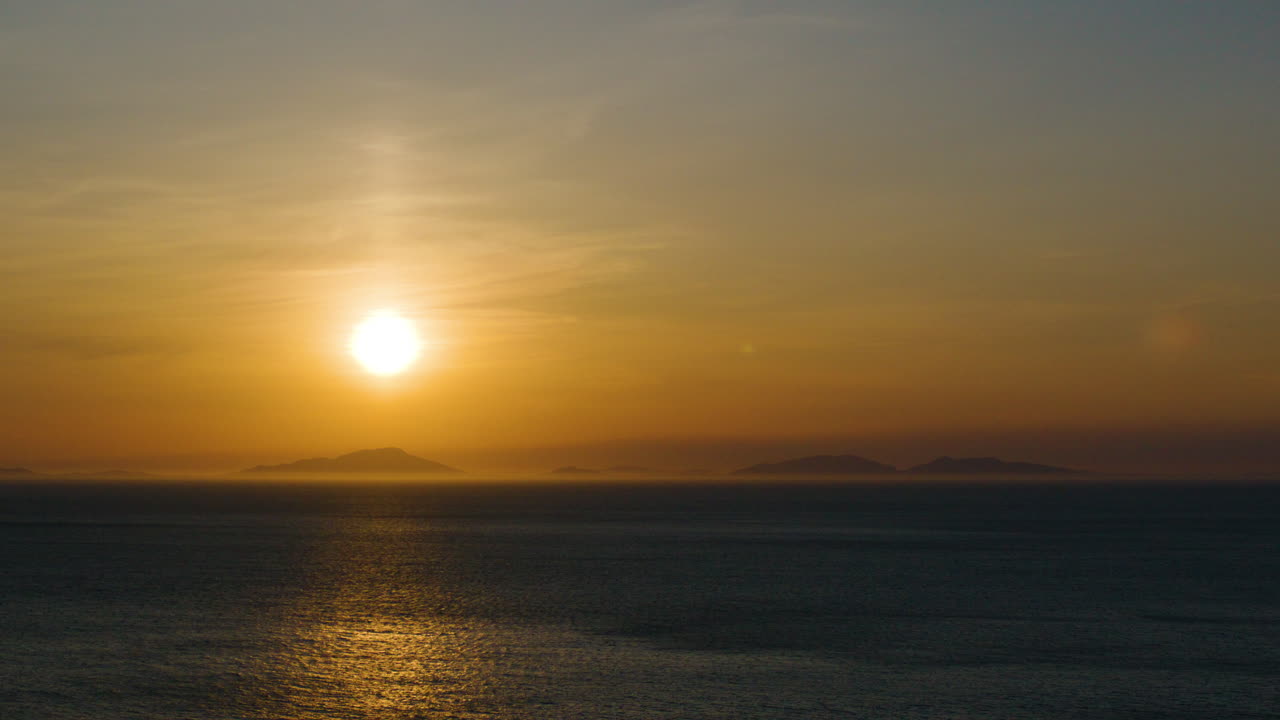 Golden sunset over tranquil sea, Isle of Skye