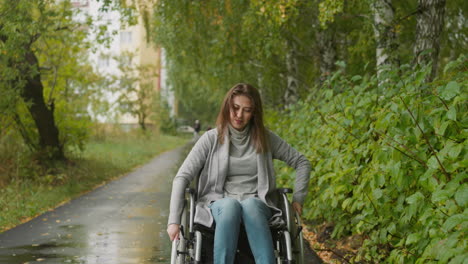 Young woman with leg injury enjoying nature on warm day