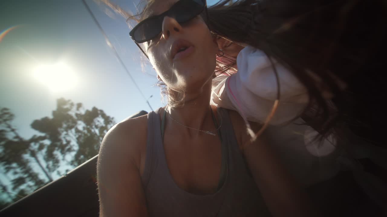 Two Young Women Enjoying a Joyful Convertible Road Trip