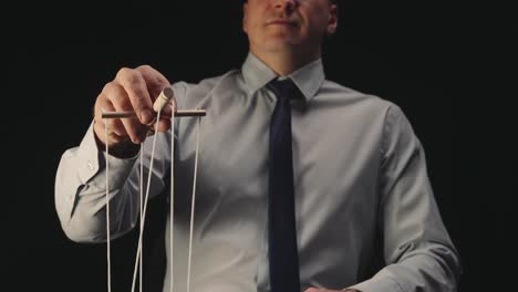 businessman controlling the strings