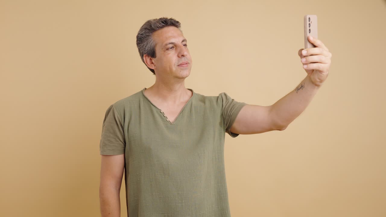 Man taking a selfie with his phone