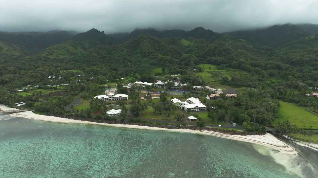 Aerial establishing frontal tracking left of abandoned hotel in Rarotonga Cook Islands