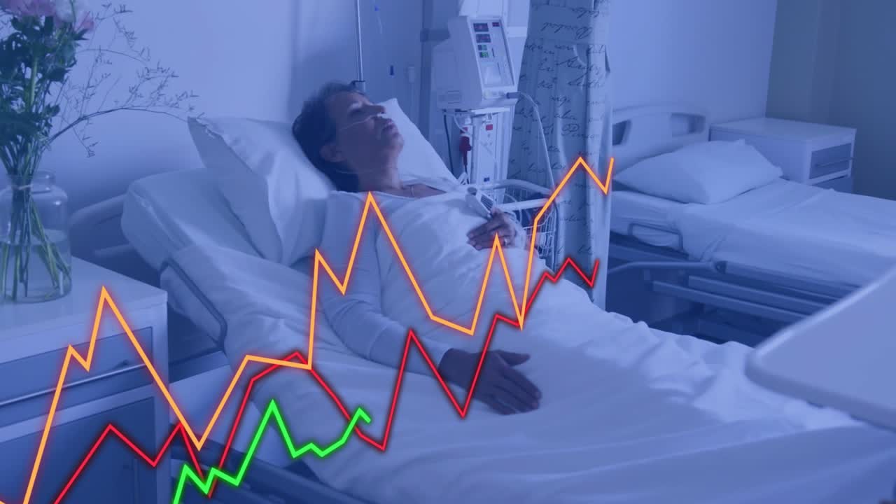 Patient kvinna som vilar i sängen nära en bildskärm med animerade grafer som övervakar vitala funktioner, med blommor.