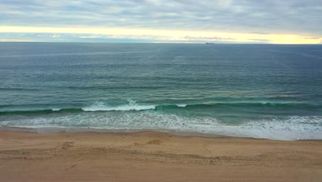 Aerial-View-Of-Empty-Beach-With-Scenic-Blue-Ocean-In-Manhattan-Beach,-California,-USA