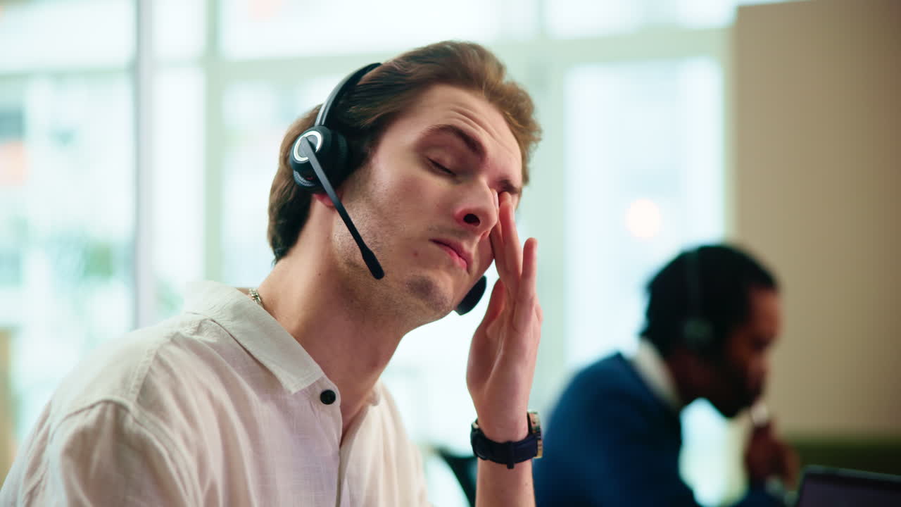 Customer service representative wearing a headset in an office