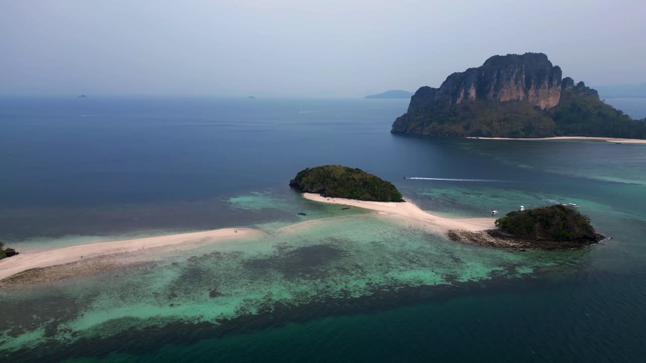 Ko Kai island with turquoise tropical sea and speed boat, Krabi, Thailand. Unbelievable aerial view flight panorama overview drone