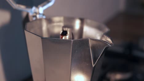 espresso coffee boiling from italian coffe maker moka pot