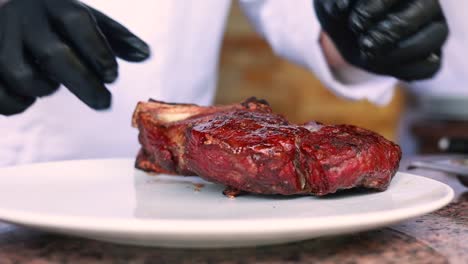 chef preparing a grilled steak