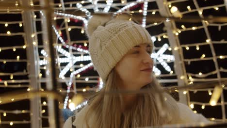 woman watching christmas lights on a great exhibition