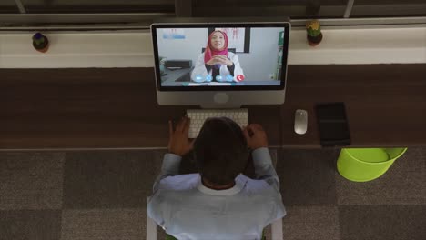 Overhead-view-of-man-having-a-video-conference-