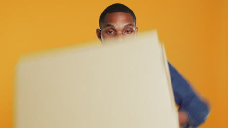 Clumsy-deliveryman-dropping-a-huge-stack-of-pizza-boxes-in-studio