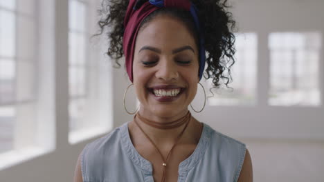 close up portrait of young independent hispanic woman laughing cheerful proud enjoying successful lifestyle change in new apartment