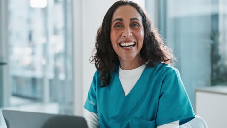 smiling nurse working at a desk