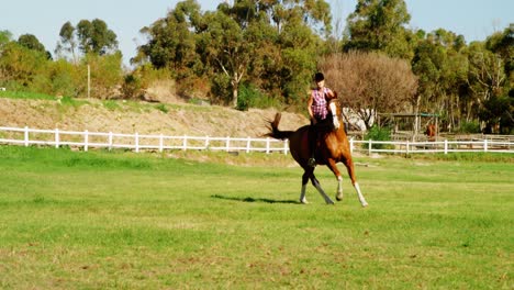 woman riding horse in ranch 4k