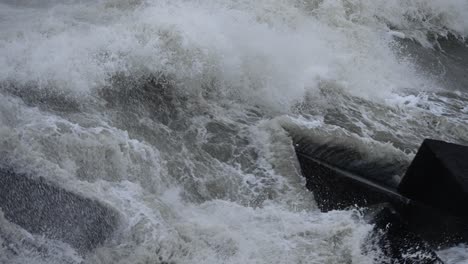 Slow-motion-close-up-of-a-huge-wave-crashing-against-the-rocks