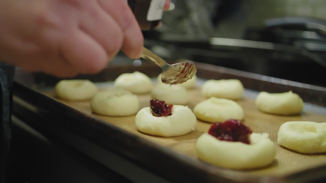 Filling Cookies with Raspberry Jam