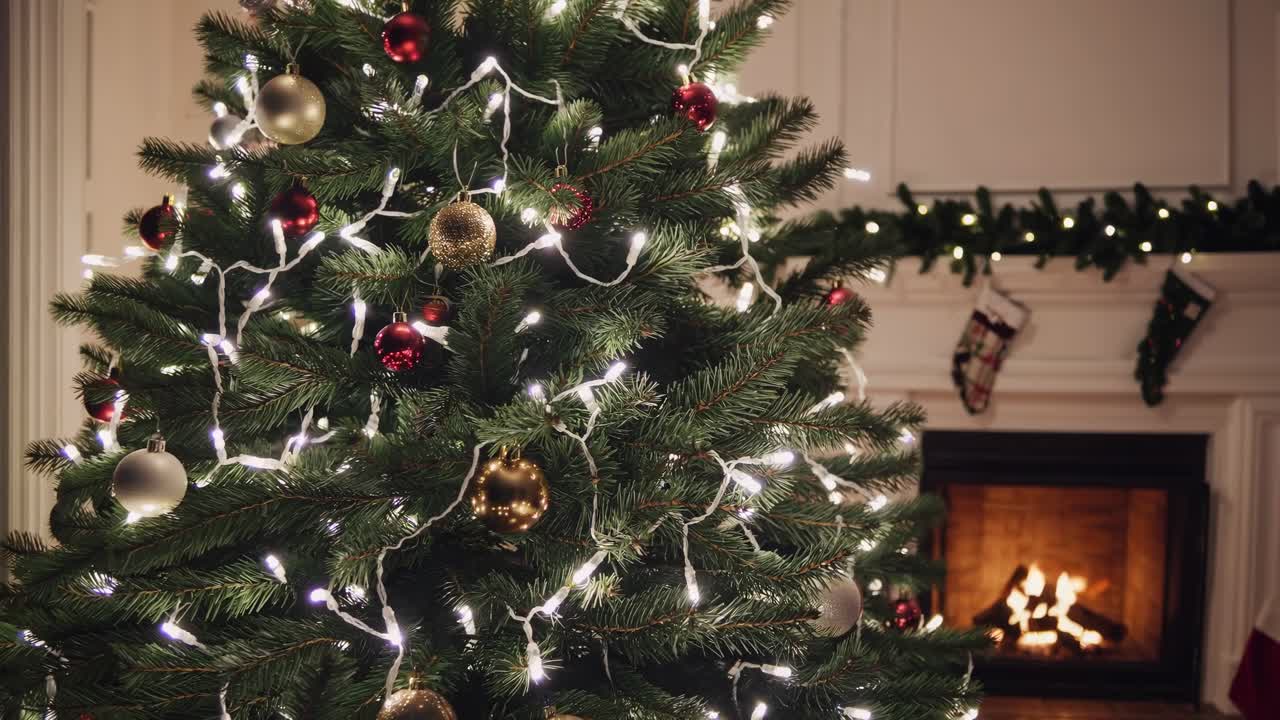 Festive Christmas tree adorned with lights and ornaments, shot from a low angle