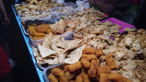 closeup at gorengan, deep fried breaded snacks typical indonesian street vendors