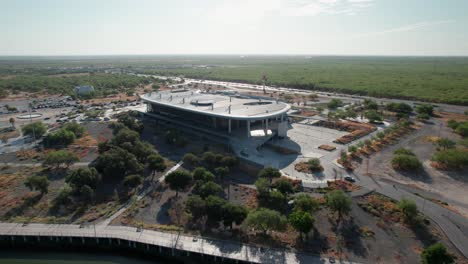 drone circling around the expo tam convention center in reynosa, tamaulipas, mexico.