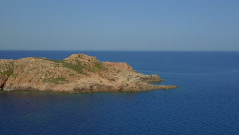 Rocky-cliff-located-in-blue-ocean