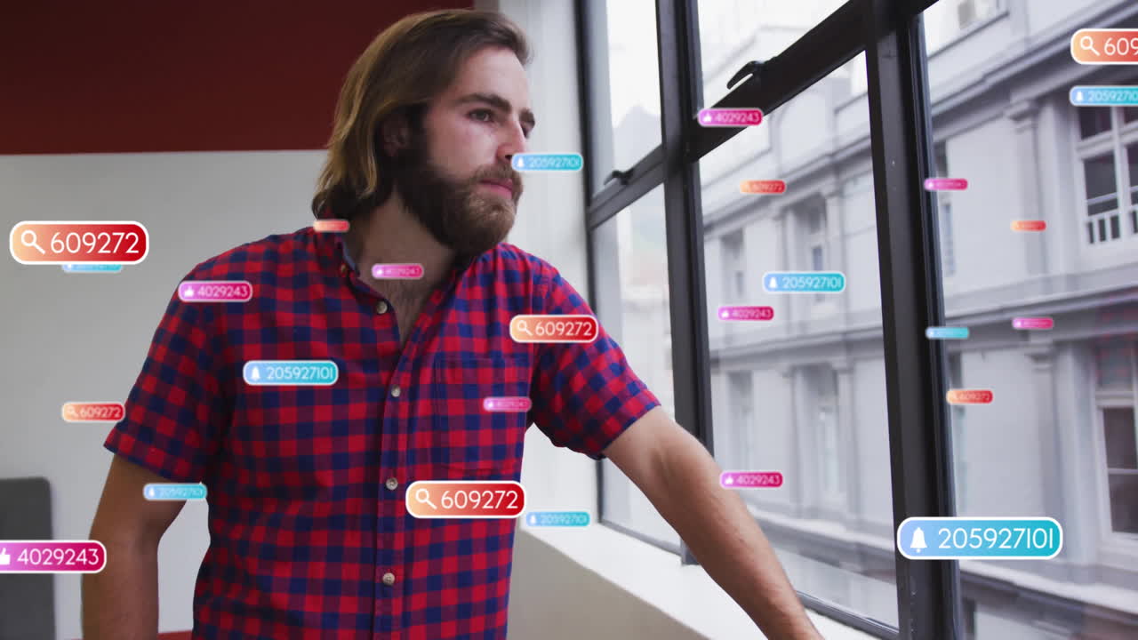 Male office worker leaning on windowsill in modern office, with floating AR tags and numeric icons