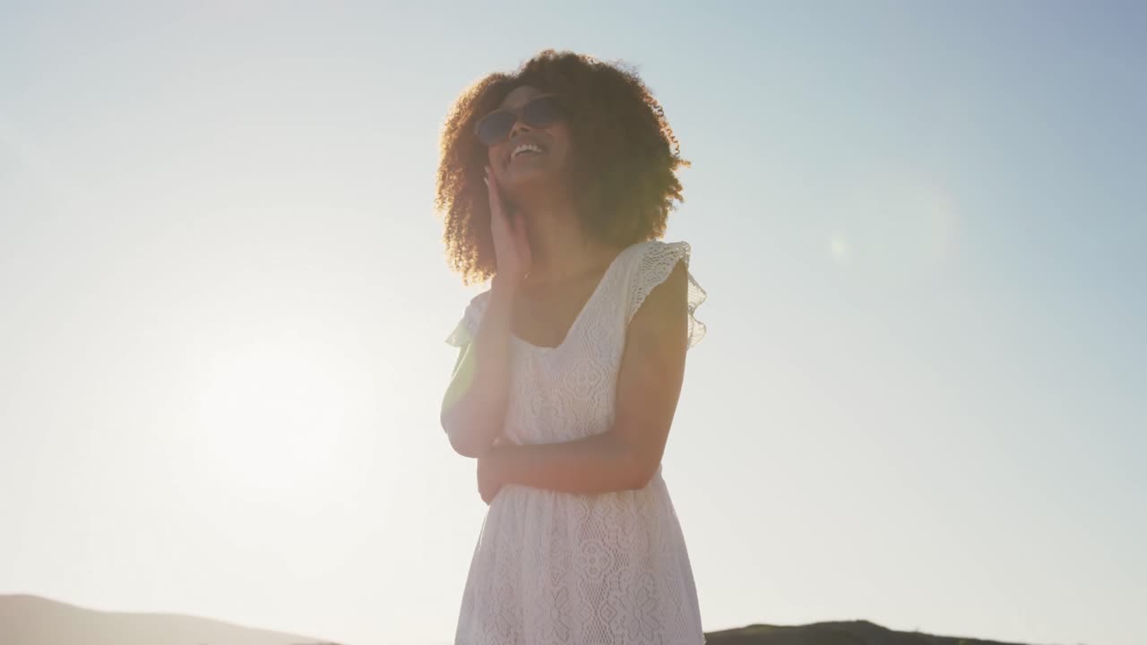 African American woman waiting at beach