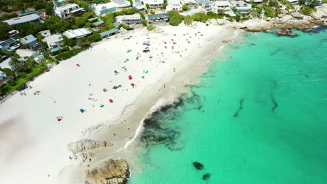 beautiful beach with turquoise water and residential area