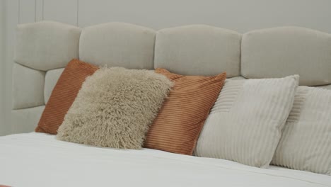 cozy bedroom detail with stylish textured pillows