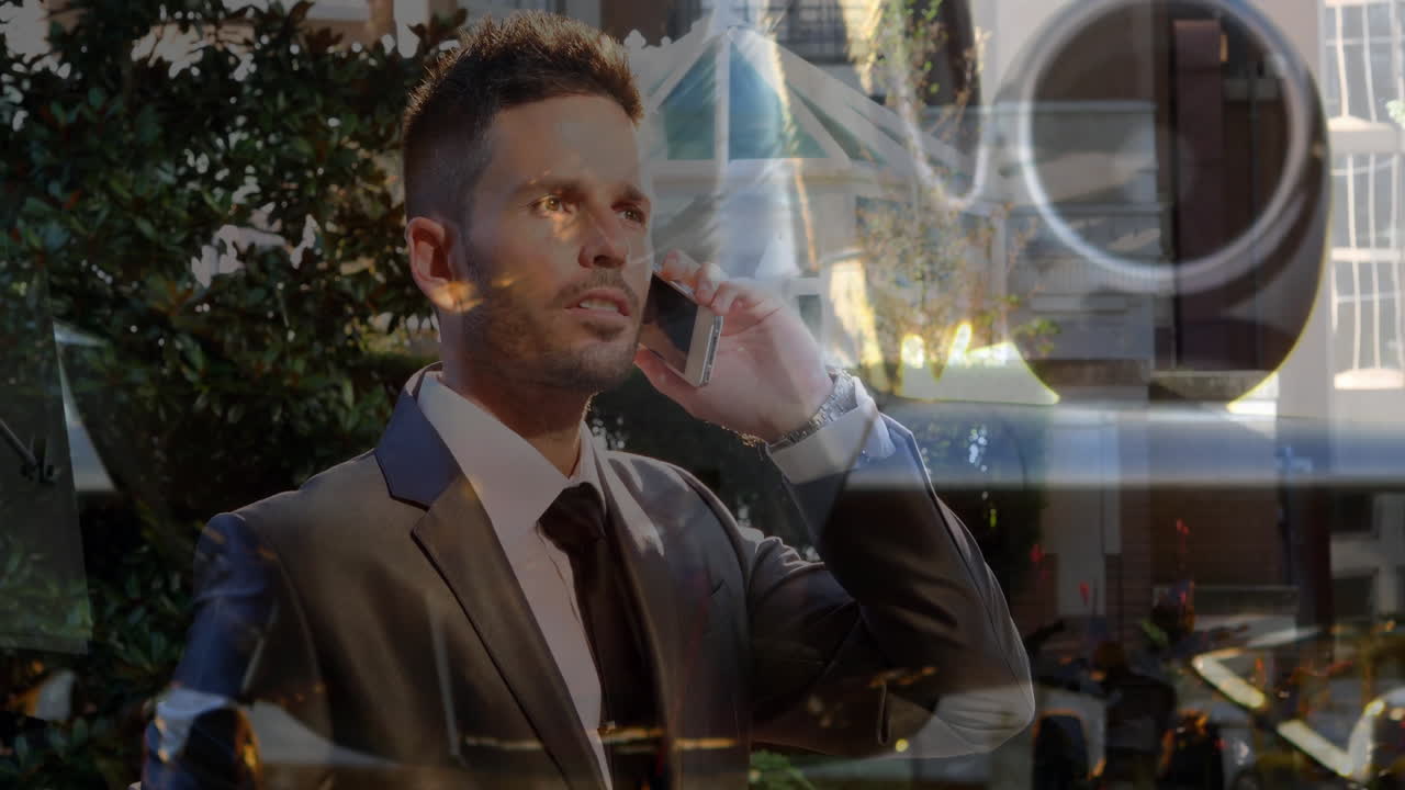 Talking on phone, businessman in suit with animation of abstract cityscape overlay