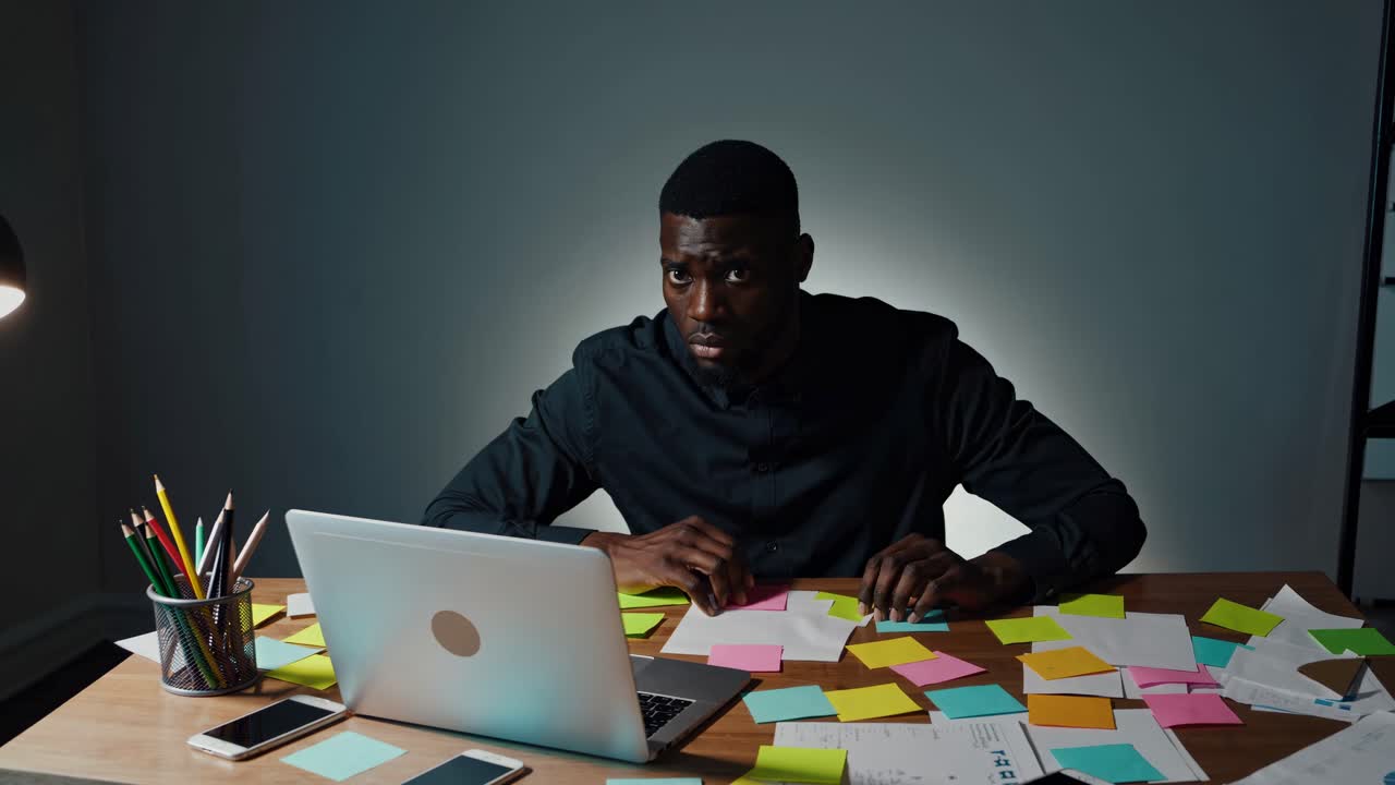 Stressed Businessman at Work Late at Night