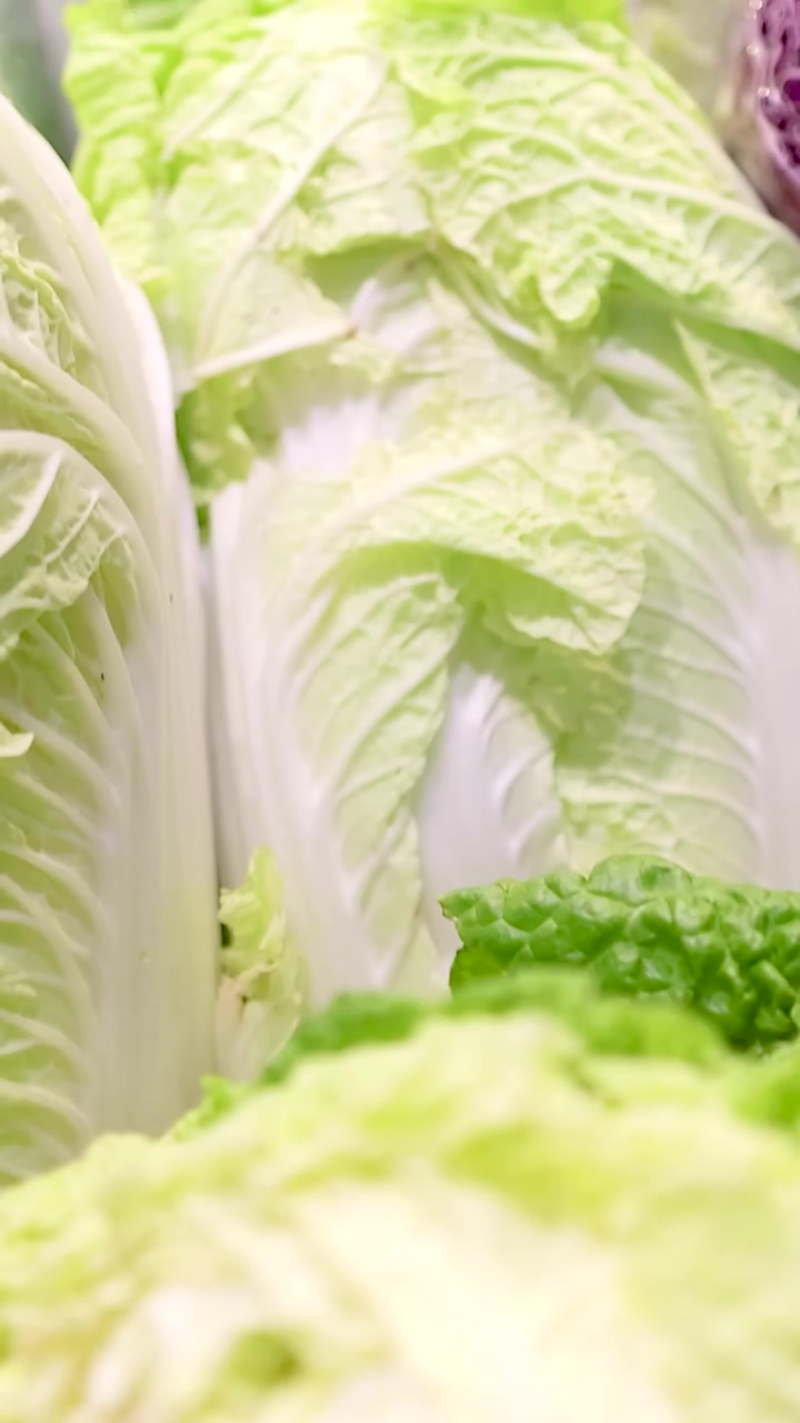 Crisp lettuce heads neatly arranged under bright lighting in a Gold Coast supermarket, showcasing vibrant greens and fresh textures