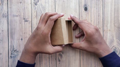 Thank-you-message-and-envelope-on-wooden-table