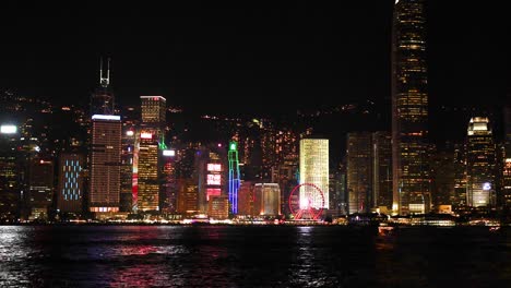 colorful lights illuminate hong kong's skyline at night