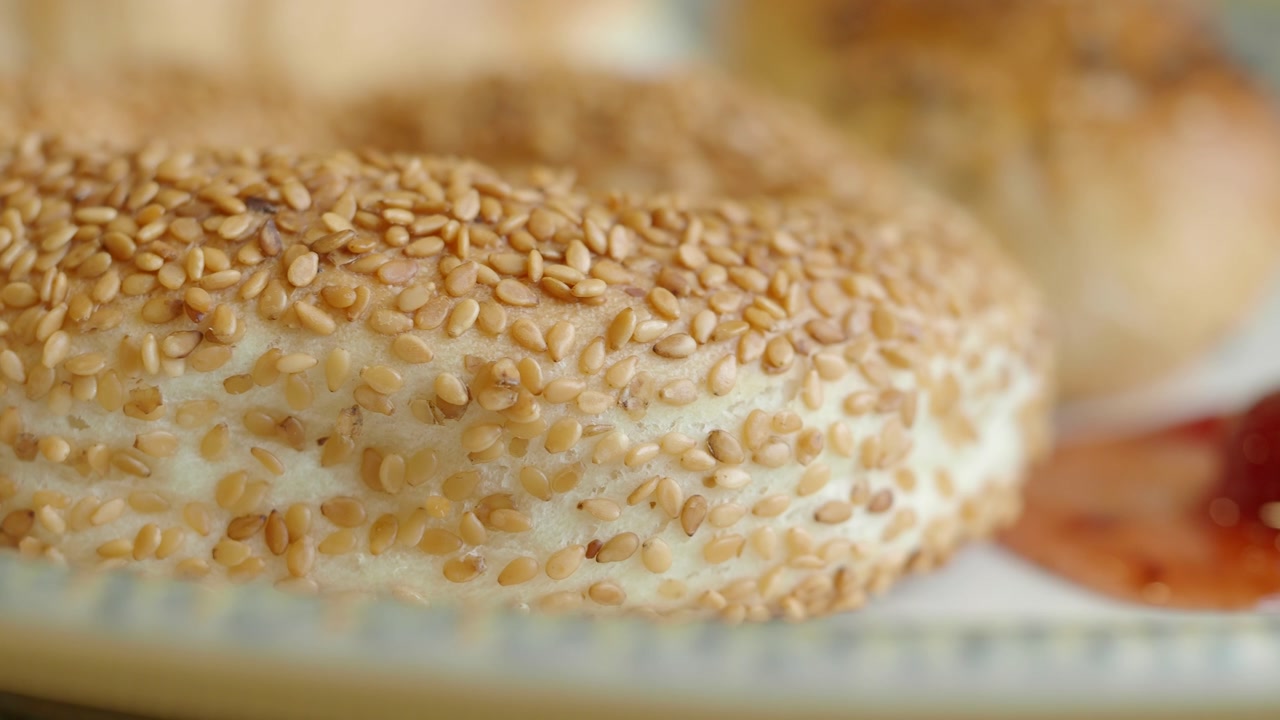 Close-up of a Sesame Seed Bagel with Jam