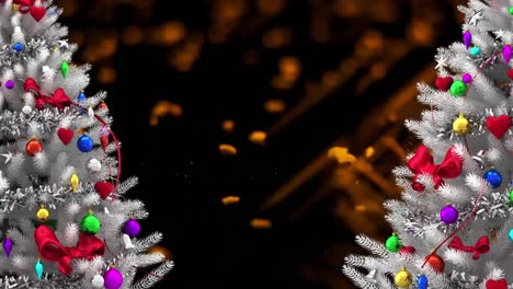 Two-white-christmas-trees-over-orange-particles-against-black-background