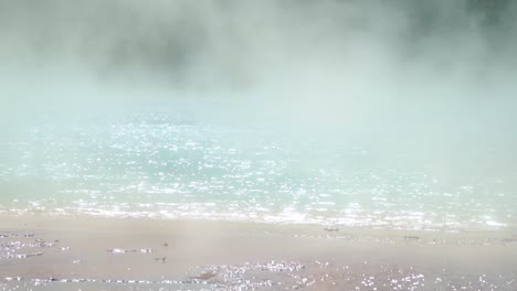 steaming hot water flows to the firehole rivere in the magnificent prismatic hot springs in yellowstone national park