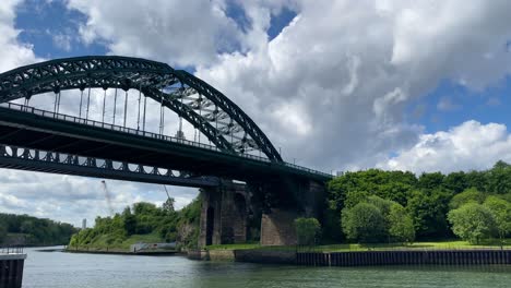 wearmouth bridge from bank of river wear in city of sunderland, uk