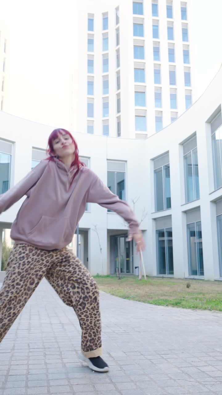 Young urban dancer performing modern moves outdoors