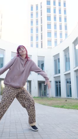 young urban dancer performing modern moves outdoors