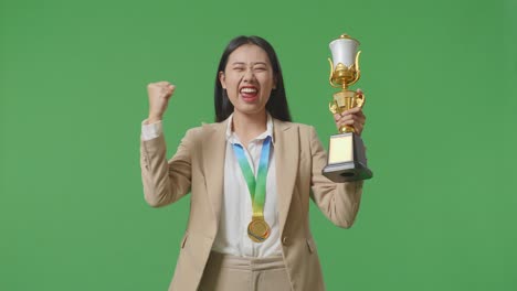 woman celebrating with a trophy